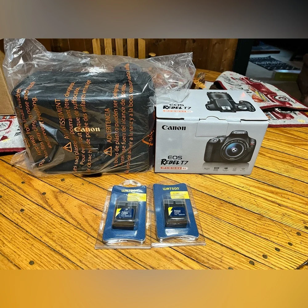 Brand new in box canon rebel t7 with lens kit! Comes with new bag and batteries